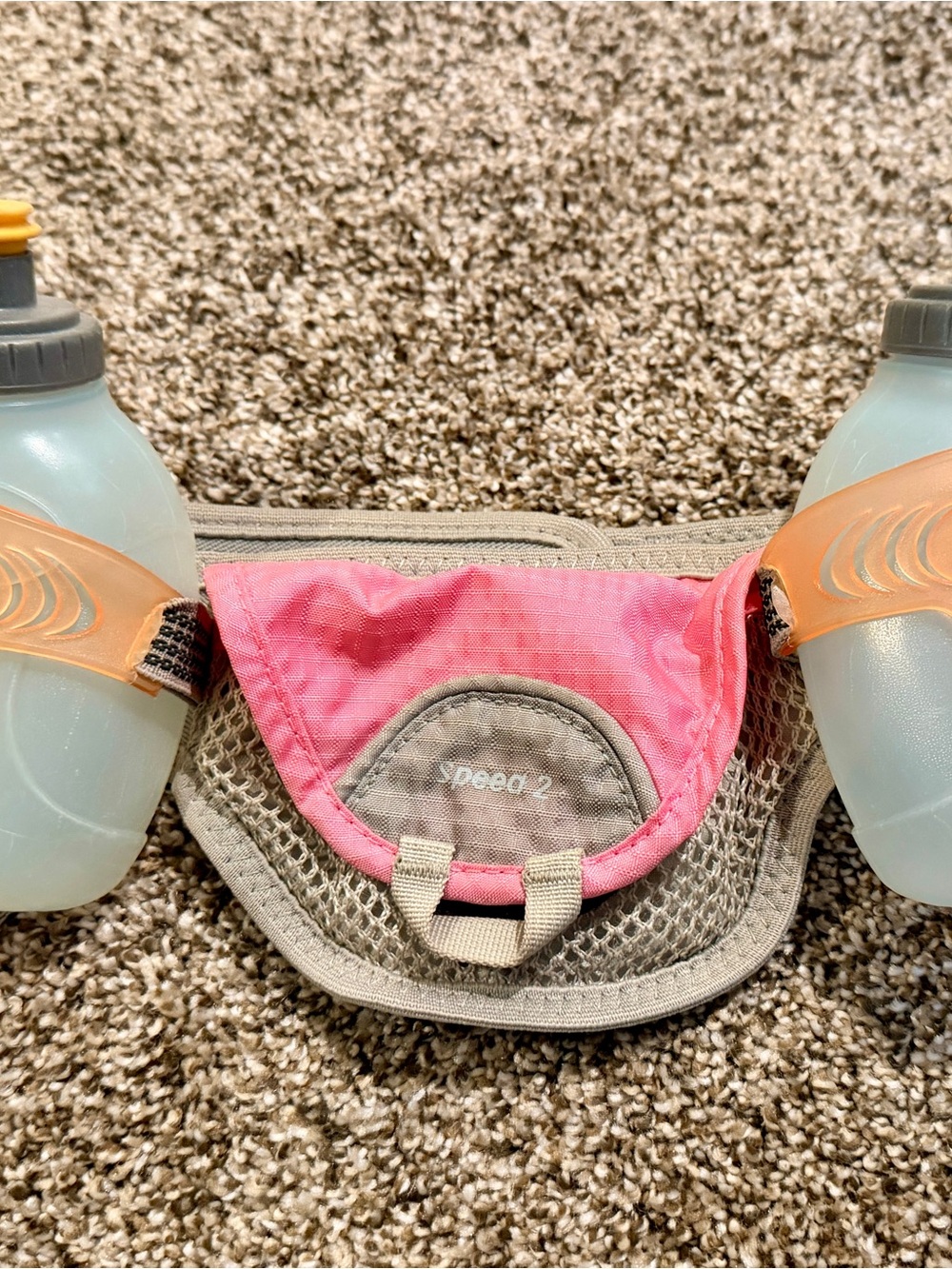 Running waist belt with water bottles & pouch.